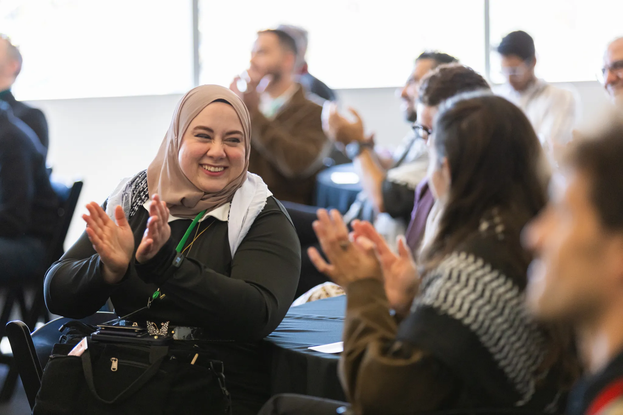 Tech for Palestine members applauding at a community event